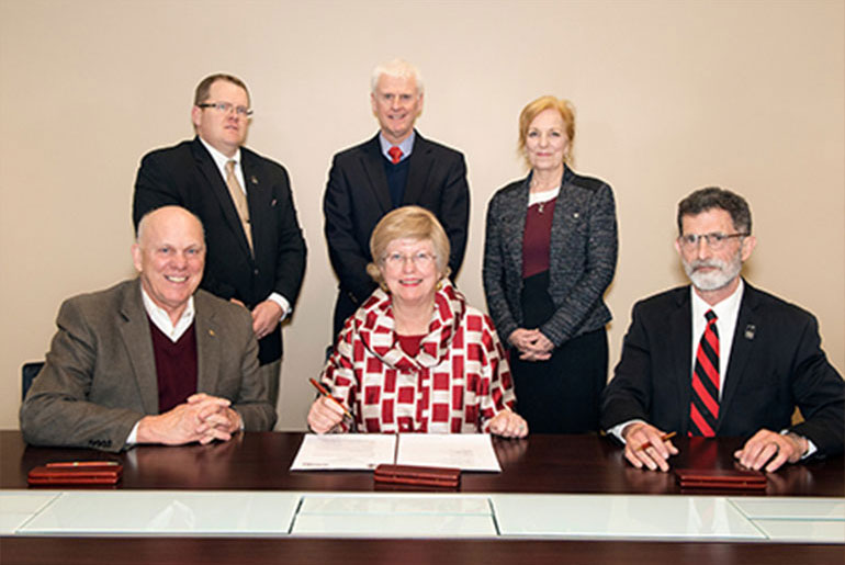 Officials sign Cooperative Agreement