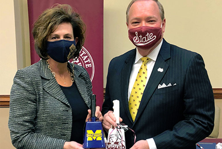 Mary Graham and Mark Keenum with cowbells