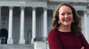 Woman standing in front of capital building