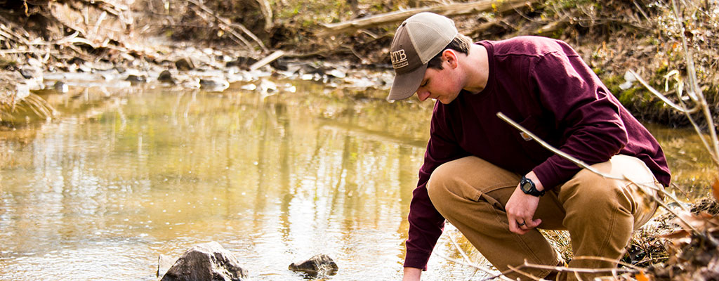 Student checking water quality