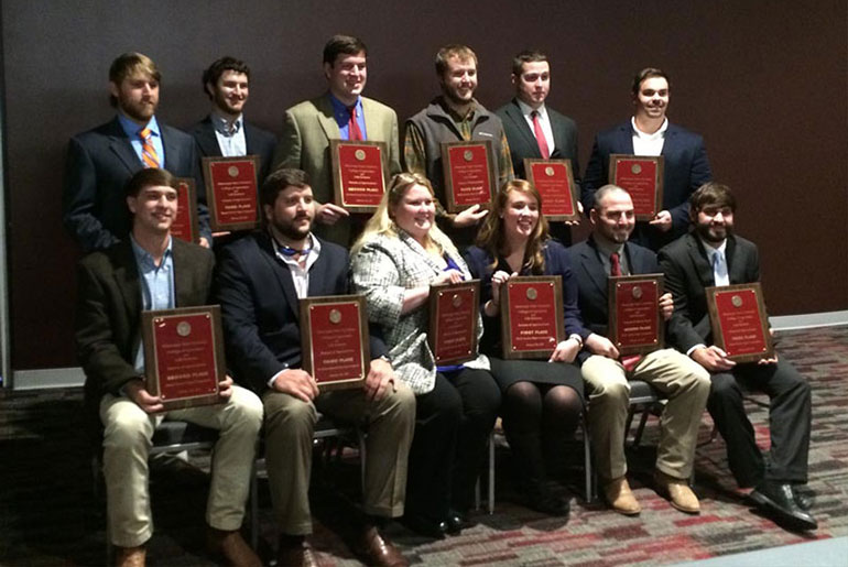 students with plaques and certificates