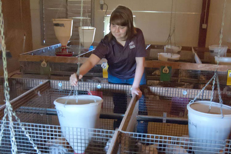 female student at poultry farm