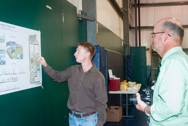 male student explains landscape design