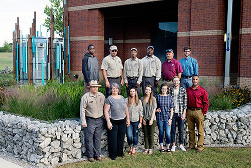Facilities Management staff, faculty and students who helped build the award-winning raingarden include: (top, l-r): Timothy Johnson, Wade Ray, Douglas Dumas, Stanley Carpenter, Rodney Barksdale and Cory Gallo; (bottom, l-r): Joe Keeton, Suzanne Powney, Maddie Marascalco, Amy Farrar, Lauryn Rody, John-Taylor Corley and Tommy Verdell Jr. (Photo by Megan Bean)