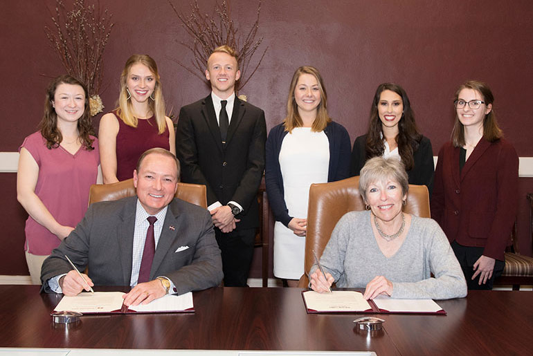 officials and students sign proclamation 