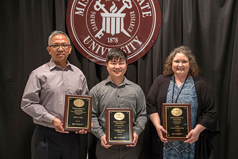 three faculty members with awards