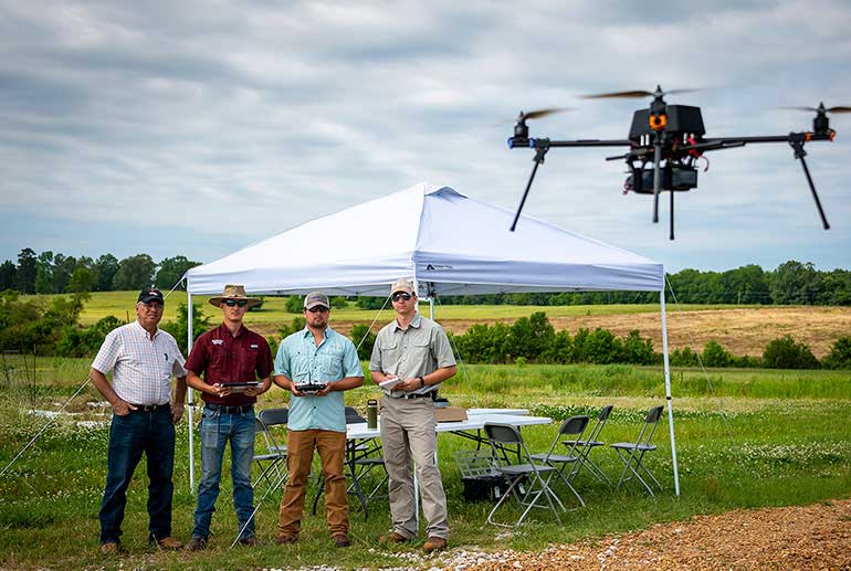 students flying a drone