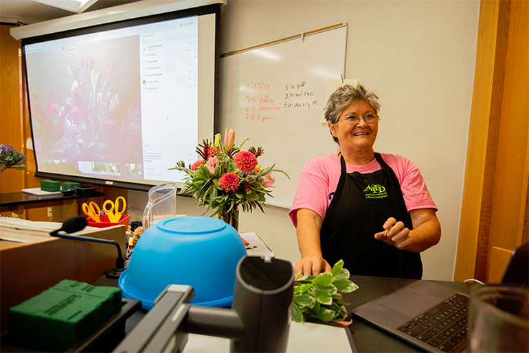 Instructor with flowers 