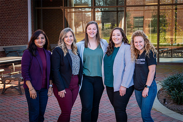 Faculty and student in Poultry Science