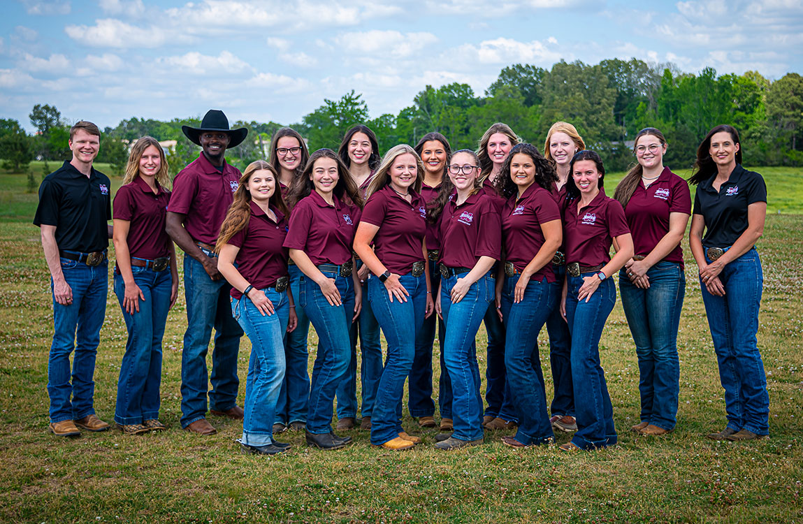 Group photo of students and equestrian coaches