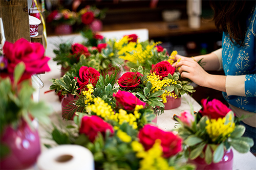 A student prepares arrangements at the University Florist.