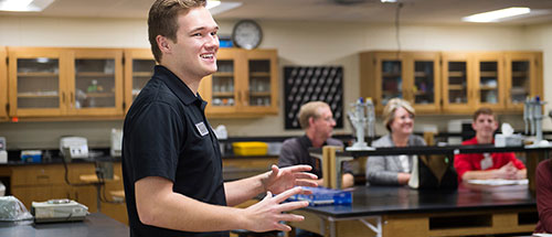 Student speaking at club event