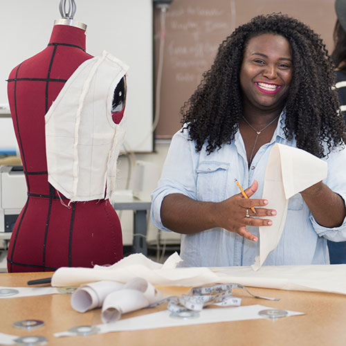 Fashion student working with fabric